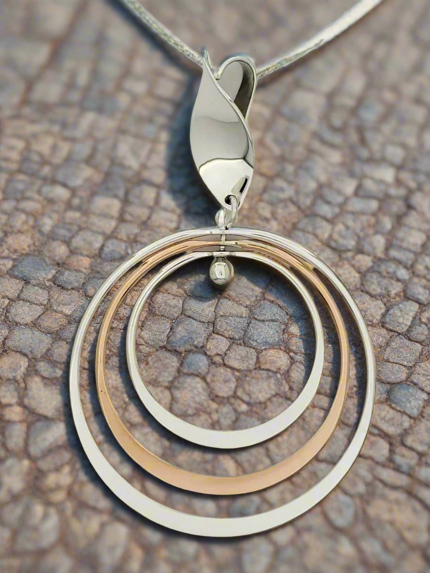 Sterling Silver Pendant with Three Bright Hoops and Seed